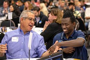 学生s have a conversation at an event